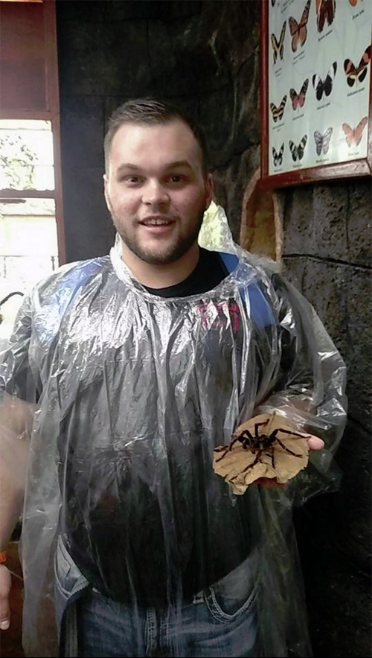 Kyle Kuxhausen, of Scottsbluff, with a tarantula.